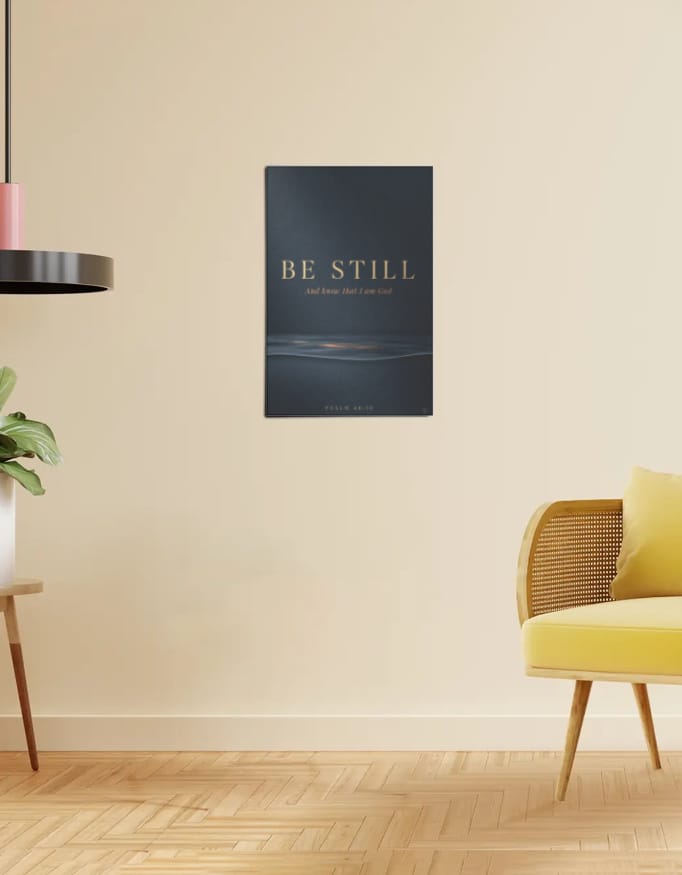 Be Still poster framed on a living room wall